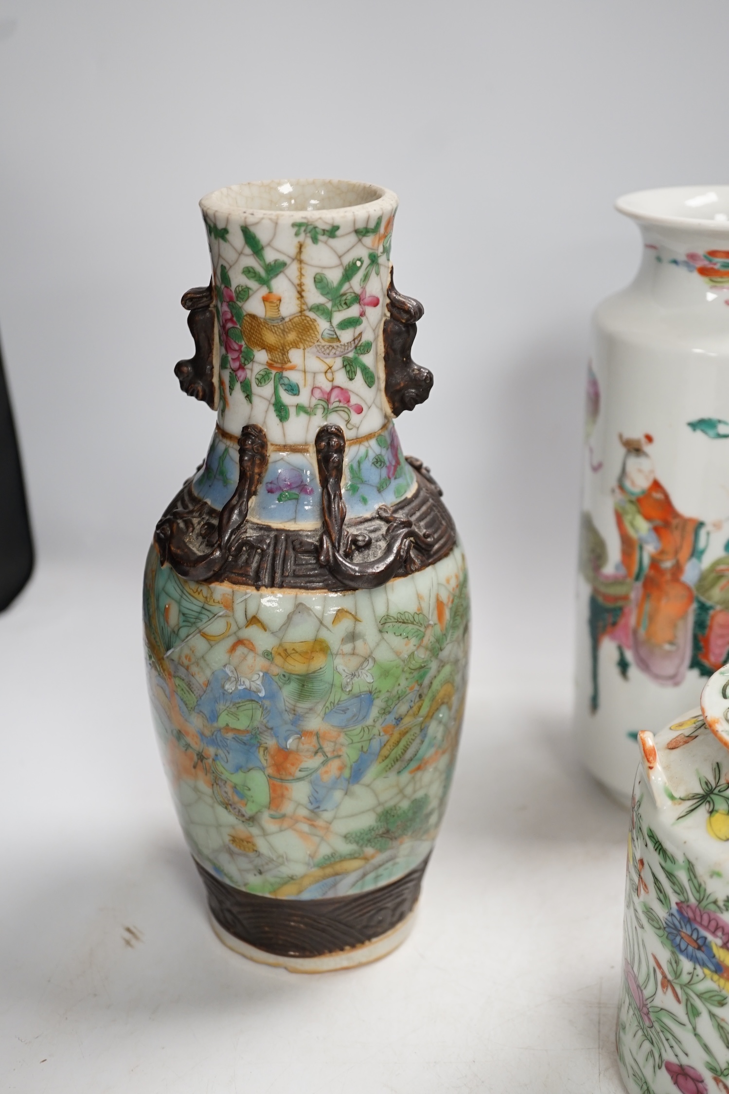 Three pairs of Chinese vases, a teapot, two bowls and a pair of miniature Satsuma vases, tallest item crackleware vases and covers 32cm high. Condition - poor